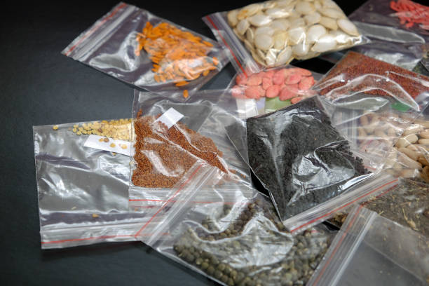 istock organic seeds packed in a wide variety on black ground, 1217251886