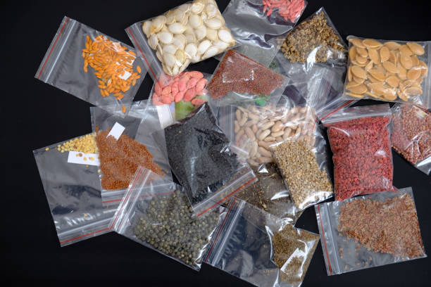 istock organic seeds packed in a wide variety on black ground, 1217251887