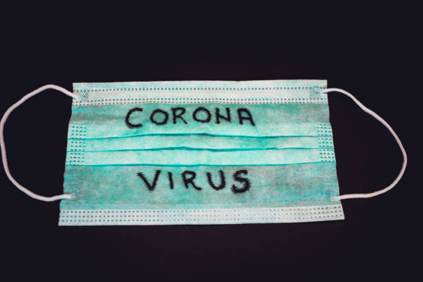 istock Medical face mask with text Coronavirus 1217252132