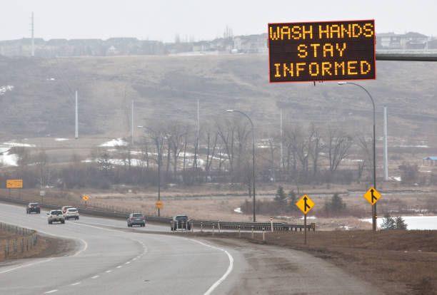 istock Wash Hands Sign on Public Roadway 1217255400