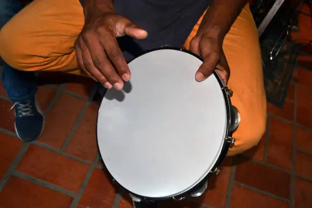 brazilian tambourine player closeup.