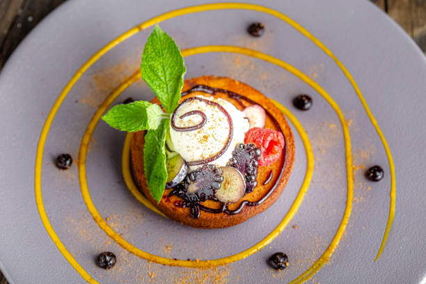 istock rustic wooden background, top and side, on a round plate, dark flour dessert, with berries, ice cream or cream, mint leaf 1217258152