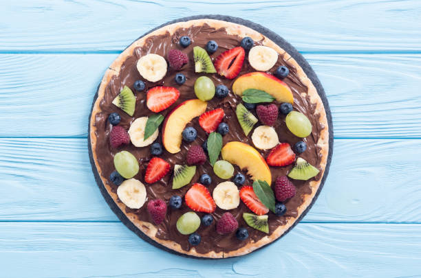 istock Fruit pizza with nut nougat cream , fruit and berries 1217259295