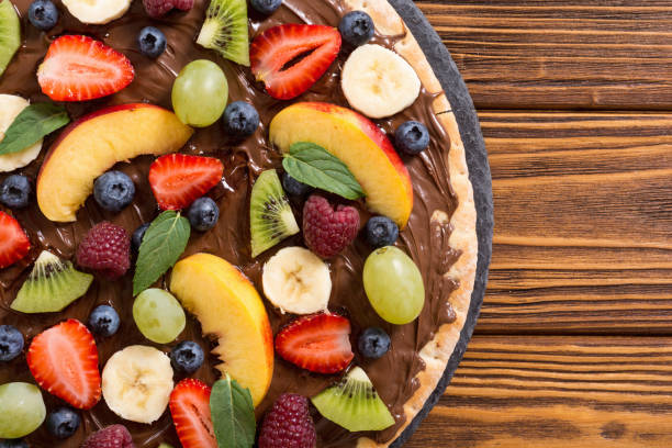 istock Fruit pizza with nut nougat cream , fruit and berries 1217259314