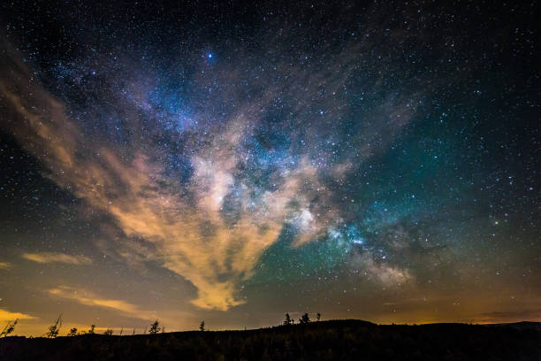 istock Scenic view of starry night sky over wide landscape 1217261069