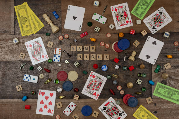 Board game theme flat lay on wood tabletop stock photo