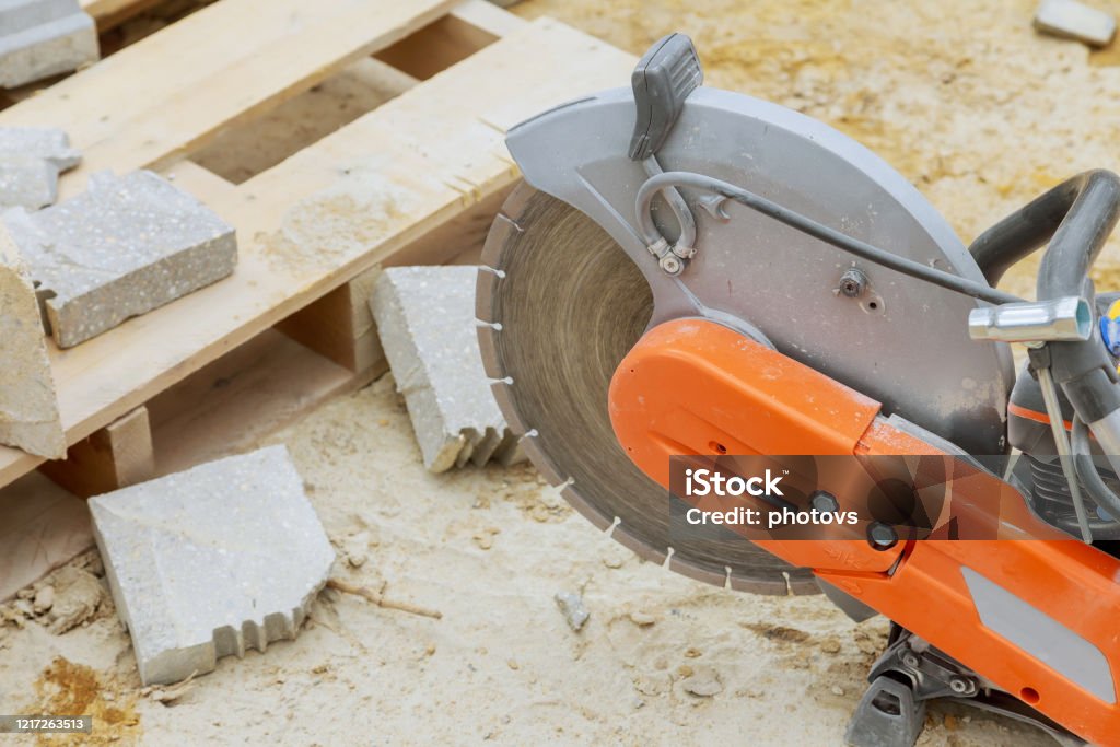 Concrete cutting with saw blade at construction site Concrete cutting with saw blade at construction at reconstruction area. Closeup Concrete Stock Photo
