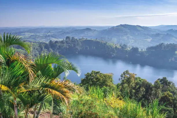 View of green mountains with a Crater Lake and the reflections on the water, Rweteera, Fort Portal, Uganda, Africa