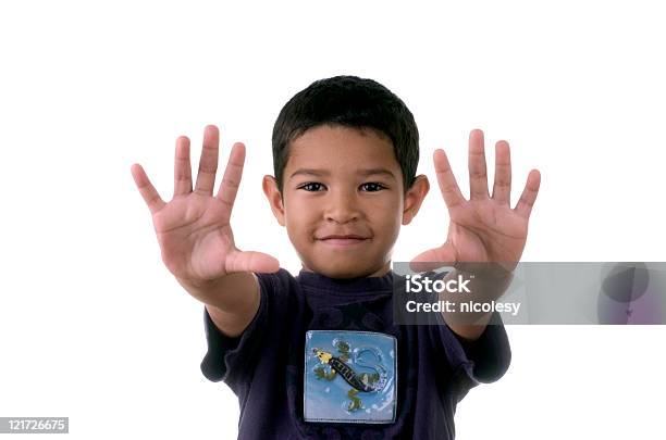 Young Boy Holding A Manos Foto de stock y más banco de imágenes de Número 10 - Número 10, Niño, Niños