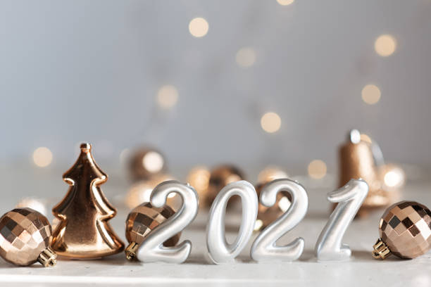 istock New Year 2021 silver balloons with fireworks 1217268935