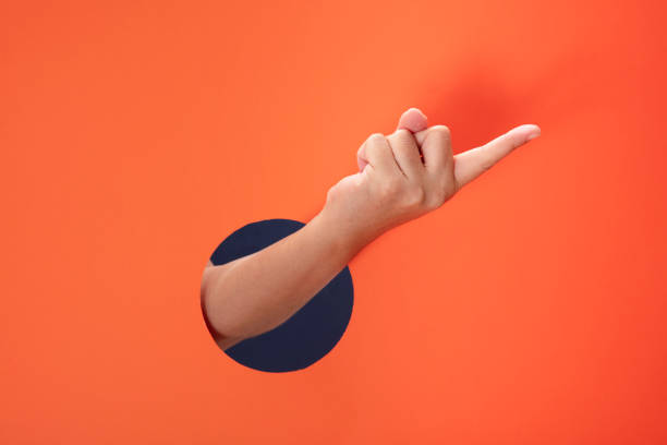The forefinger points to the right side. stock photo