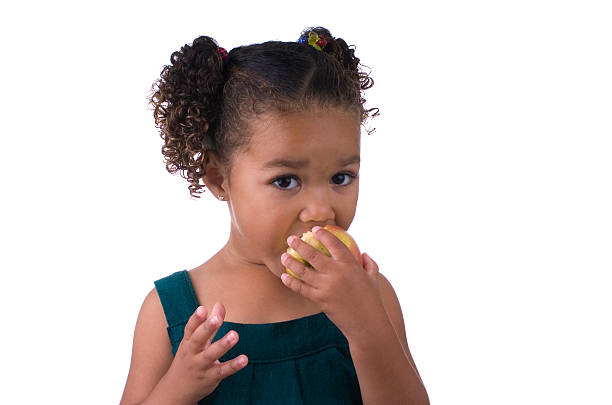 istock Little Girl Eating an Apple 121727736