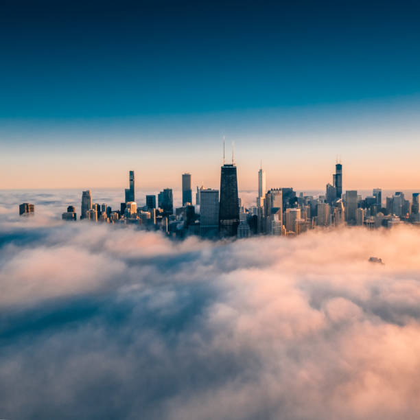istock Dramatic View of Chicago wrapped by Fog 1217280406