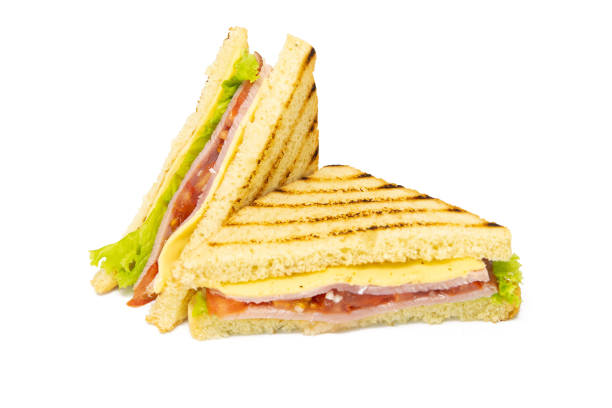 istock Sandwich with ham, cheese, tomatoes, lettuce, and toasted bread. Front view isolated on white background 1217286339