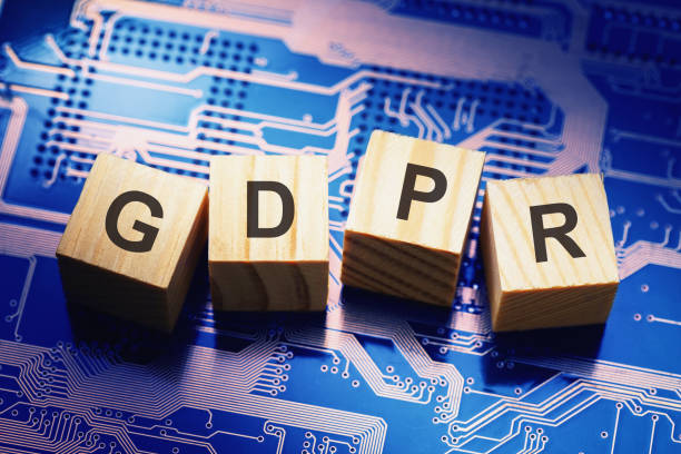 istock Wooden cubes with text on microcircuit background, symbolizing the EU General Data Protection Regulation or GDPR 1217286449