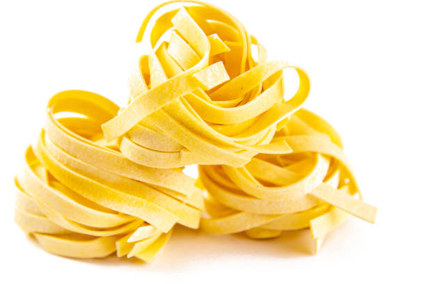 istock Row dry nest pasta on white bacground. Front views 1217286552