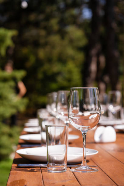 istock Served wooden table without a tablecloth. Cafe in the open air park 1217287973