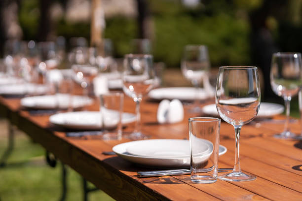 istock Served wooden table without a tablecloth. Cafe in the open air park 1217288167
