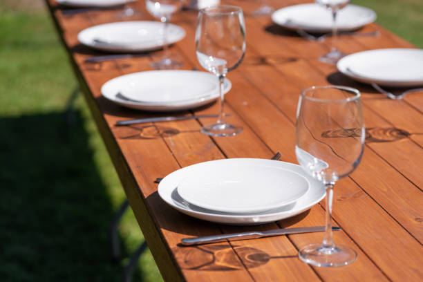 istock Served wooden table without a tablecloth. Cafe in the open air park 1217288725