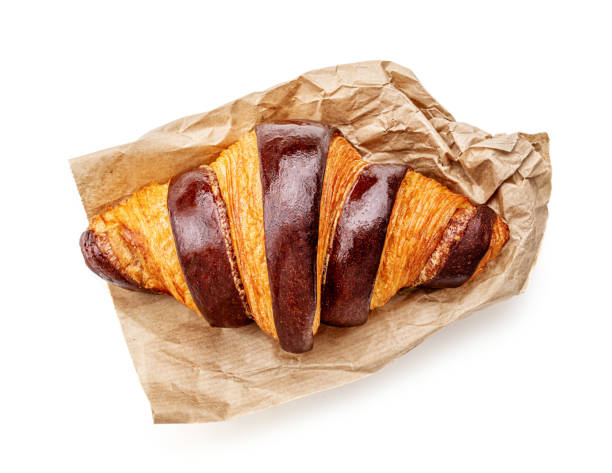 freshly baked chocolate croissant isolated on white background, top view. close up. - baking traditional culture studio shot horizontal imagens e fotografias de stock