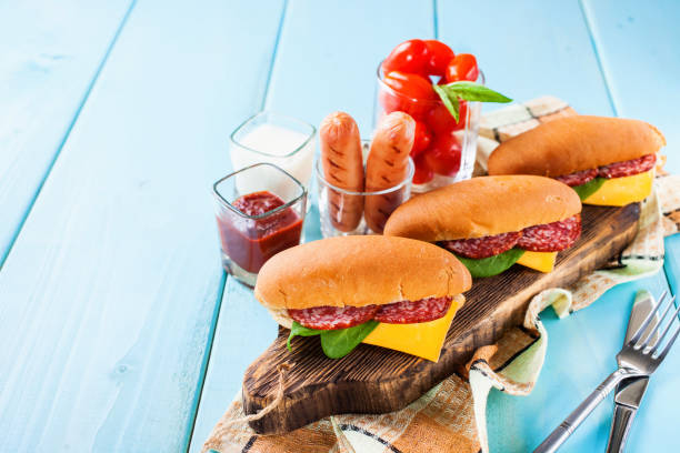 istock breakfast - sandwiches, sausages and tomatoes on a table, selective focus, copy space 1217290215
