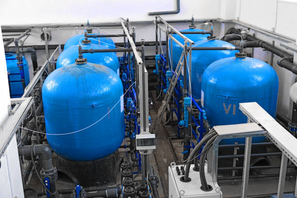 istock many big blue water tanks inside wastewater treatment facility, industrial interior inside 1217290900