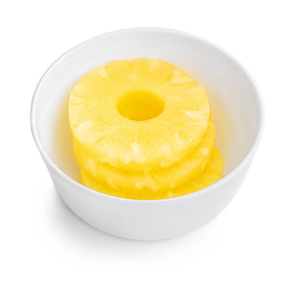 istock Pineapple rings ib a bowl. Fresh Pineapple slice isolated on white background. Close up. Top view 1217292012