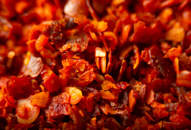 赤い粉の唐辛子の背景テクスチャをクローズアップ - meal red nature close up ストックフォトと画像