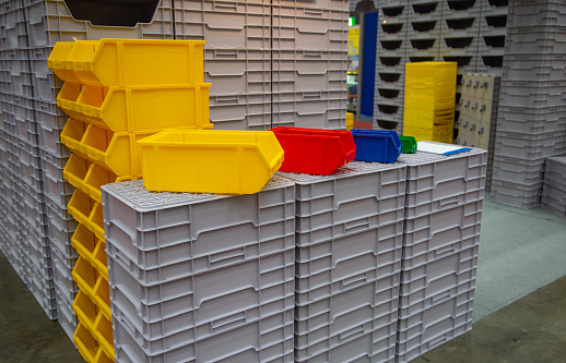 Stack of industrial open plastic bin rack