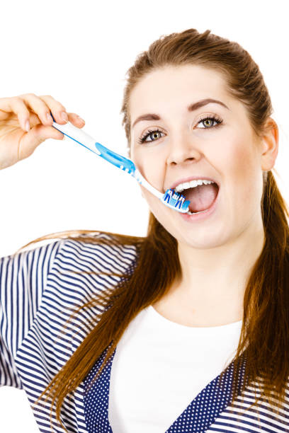 istock Woman brushing cleaning teeth. 1217301872