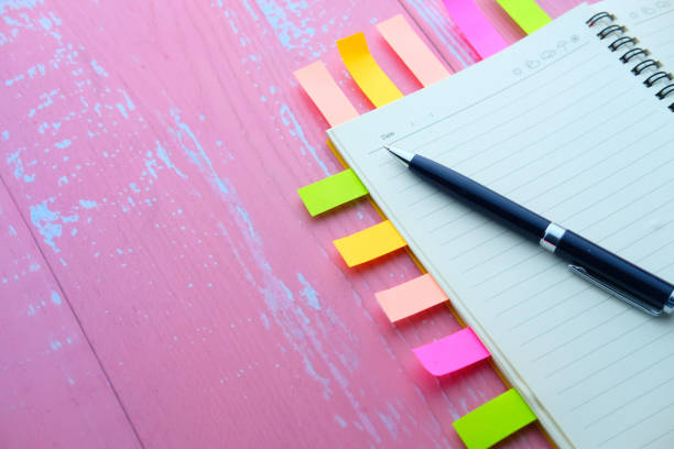 istock close up of notepad with note stickers on table 1217304166