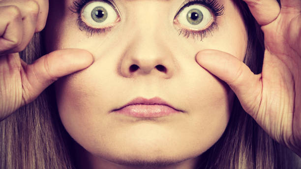 istock Woman having weirdly wide open eyes 1217304343