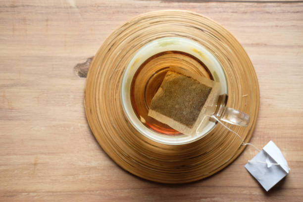 istock top view of green tea and tea bag on table 1217304367