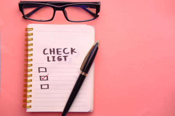 istock top view of check mark on notepad on color background 1217304593