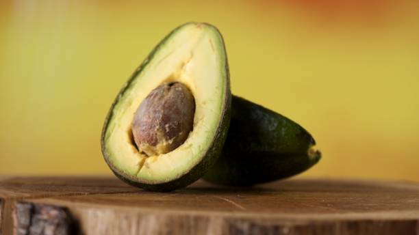 istock Ripe avocado fruit on a wooden surface 1217305893