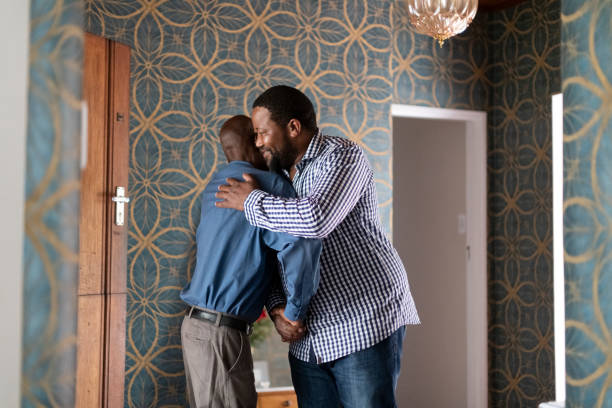 istock Man embraces senior father reunited after lockdown quarantine 1217305960