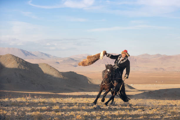 istock Kazakh eagle hunter after winning a traditional wrestiling match. 1217309156