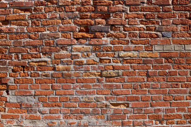istock Texture of an old brick wall. Old red brick masonry. The brick background. 1217312807