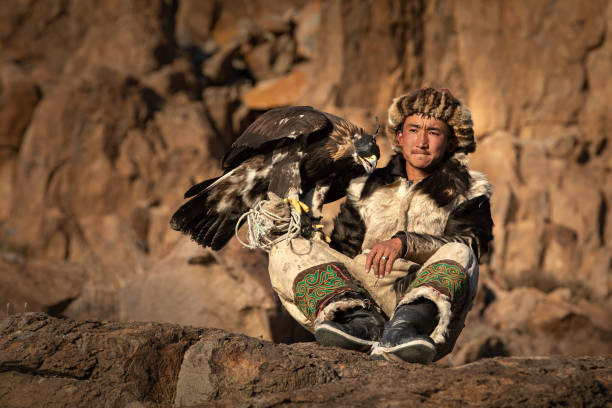 istock Young kazakh eagle hunter with his golden eagle. 1217313850