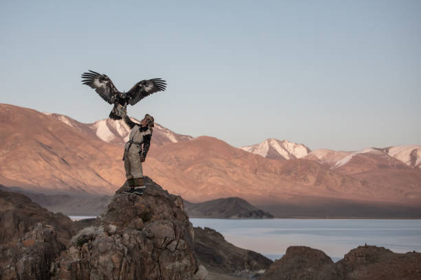 istock Young kazakh eagle hunter with his golden eagle. 1217313857