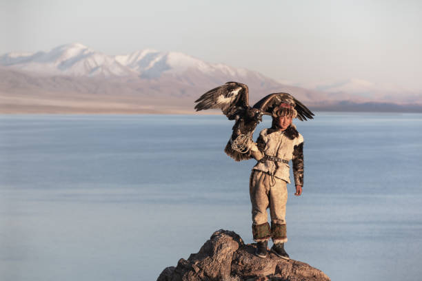 istock Young kazakh eagle hunter with his golden eagle. 1217313862