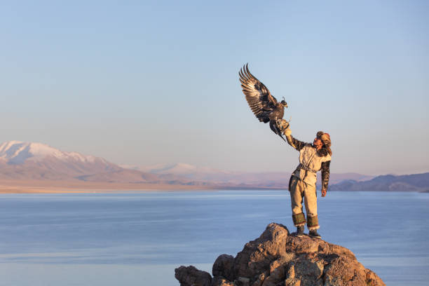 istock Young kazakh eagle hunter with his golden eagle. 1217313869