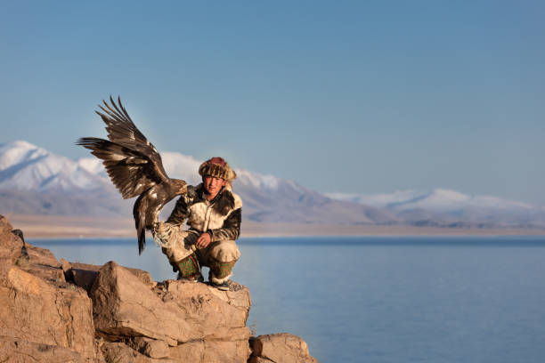istock Young kazakh eagle hunter with his golden eagle. 1217314037
