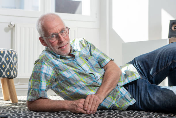 istock a senior man lying on floor and resting 1217316996