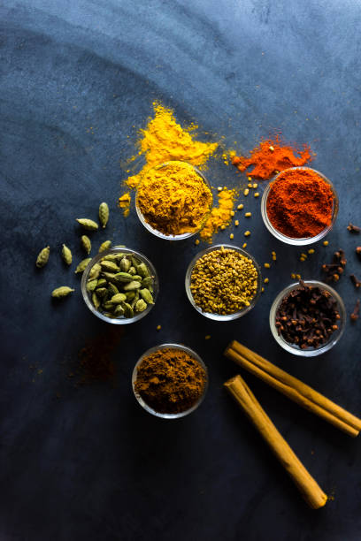 istock Variety of spices and herbs on kitchen table 1217318061