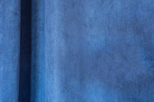 明るいブルーのファブリックテクスチャクローズアップカーテン、ブルーベルベット、モダンなデザインの背景 - blue silk focus on foreground abstract ストックフォトと画像