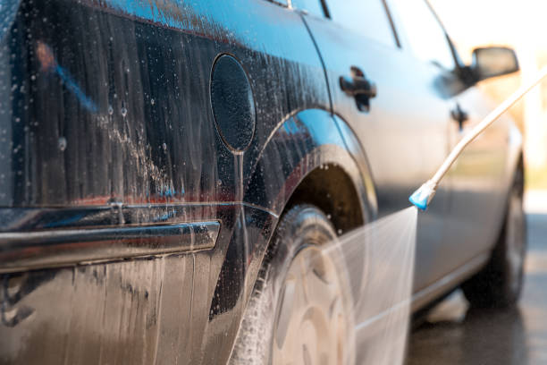 istock manual car wash by spraying treated water under high pressure 1217320702