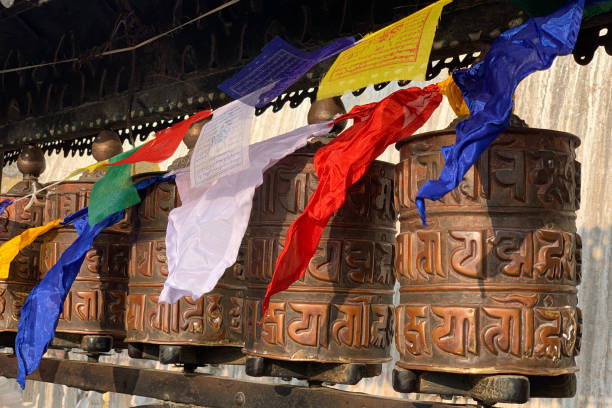 Prayer Wheels Swayambhunath Stupa (Monkey Temple) Prayer Wheels and flags Swayambhunath Stupa (Monkey Temple), Kathmandu buddhist prayer wheel stock pictures, royalty-free photos & images