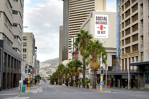 Cape Town, South Africa - 6 April 2020 : Empty streets and a social distancing sign in Cape Town during the Coronavirus lockdown