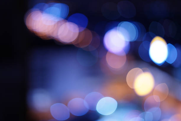 istock The street light Blur bokeh, multicolored oval pattern dark background 1217323100